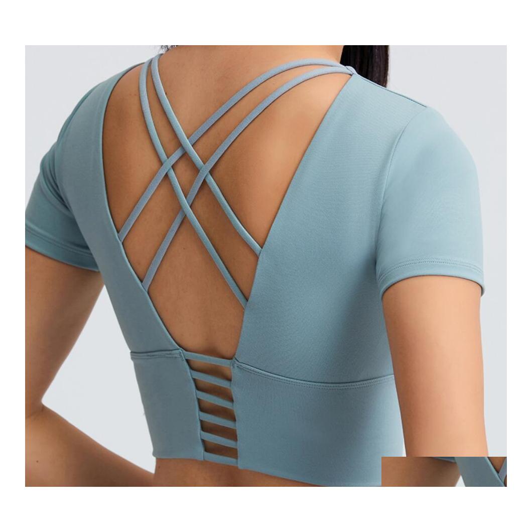 Yoga Outfits L016 Crop Top Women Shirts Padded Bra Tops Short Sleeve Solid Color Soft Gym Sports Wear Drop Delivery Outdoors Athleti Dhp5P, Black
Yoga Outfits L016 Crop Top Women Shirts Padded Bra Tops Short Sleeve Solid Color Soft Gym Sports Wear Drop Delivery Outdoors Athleti Dhp5P, Black