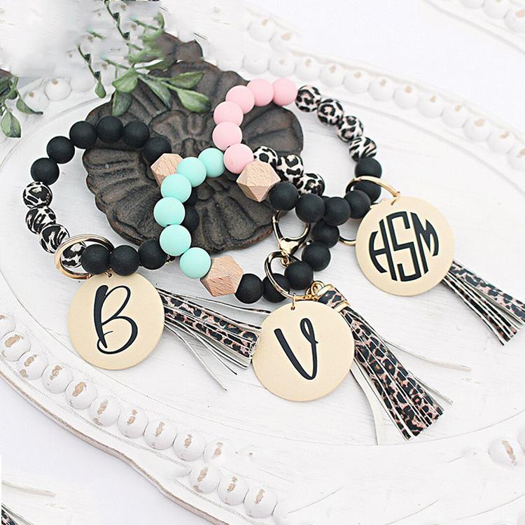 Keychains Fashion Silicone Wood Bead Bracelet Primary Color Disk Keychain Leopdard Tassel Wrist Key Ring Pendant AccessoryKeychains
Keychains Fashion Silicone Wood Bead Bracelet Primary Color Disk Keychain Leopdard Tassel Wrist Key Ring Pendant AccessoryKeychains