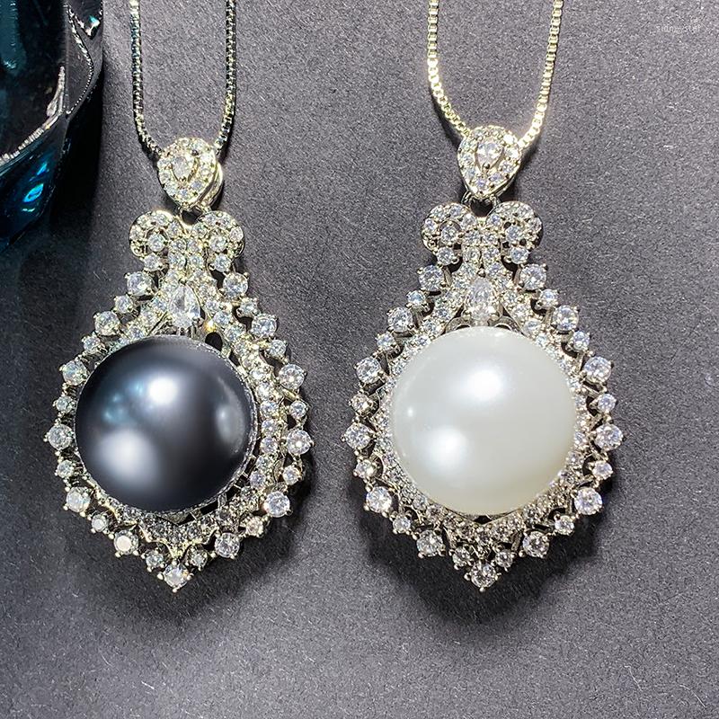 Pendant Necklaces EYIKA Fashion Paved Zircon Silver Color Flower Necklace Luxury White Black Big Pearl Women Vintage Party Jewelry
Pendant Necklaces EYIKA Fashion Paved Zircon Silver Color Flower Necklace Luxury White Black Big Pearl Women Vintage Party Jewelry