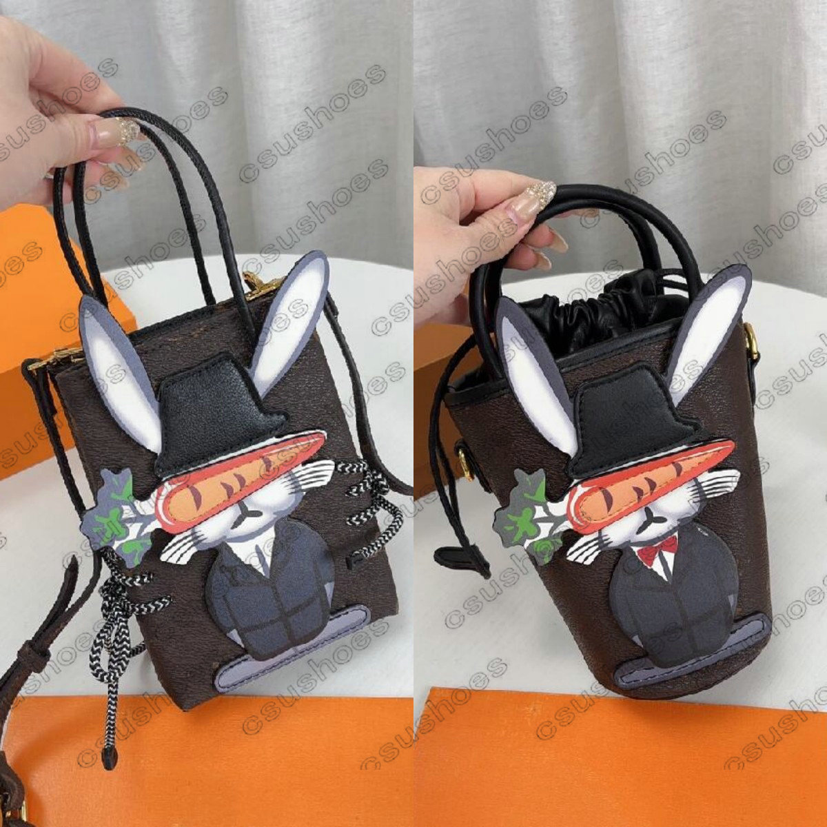 Designer Rabbit Mobile Phone Bag Drawstring Women Mini Bucket Cross Body Shaped Tote Pocket Bunny Handbag Luxurys Bags Luxury Music Package Purses Cute Cartoon, Customize
Designer Rabbit Mobile Phone Bag Drawstring Women Mini Bucket Cross Body Shaped Tote Pocket Bunny Handbag Luxurys Bags Luxury Music Package Purses Cute Cartoon, Customize