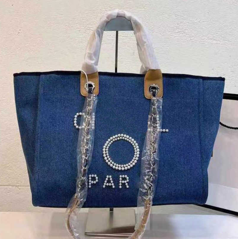 Classics CH Luxury Women's Hand Bags Embroidered Brand Handbag Female Pearl Beach Bag Big Shopping Small Backpacks Canvas Chain Backpack Evening Handbags 6guf
Classics CH Luxury Women's Hand Bags Embroidered Brand Handbag Female Pearl Beach Bag Big Shopping Small Backpacks Canvas Chain Backpack Evening Handbags 6guf