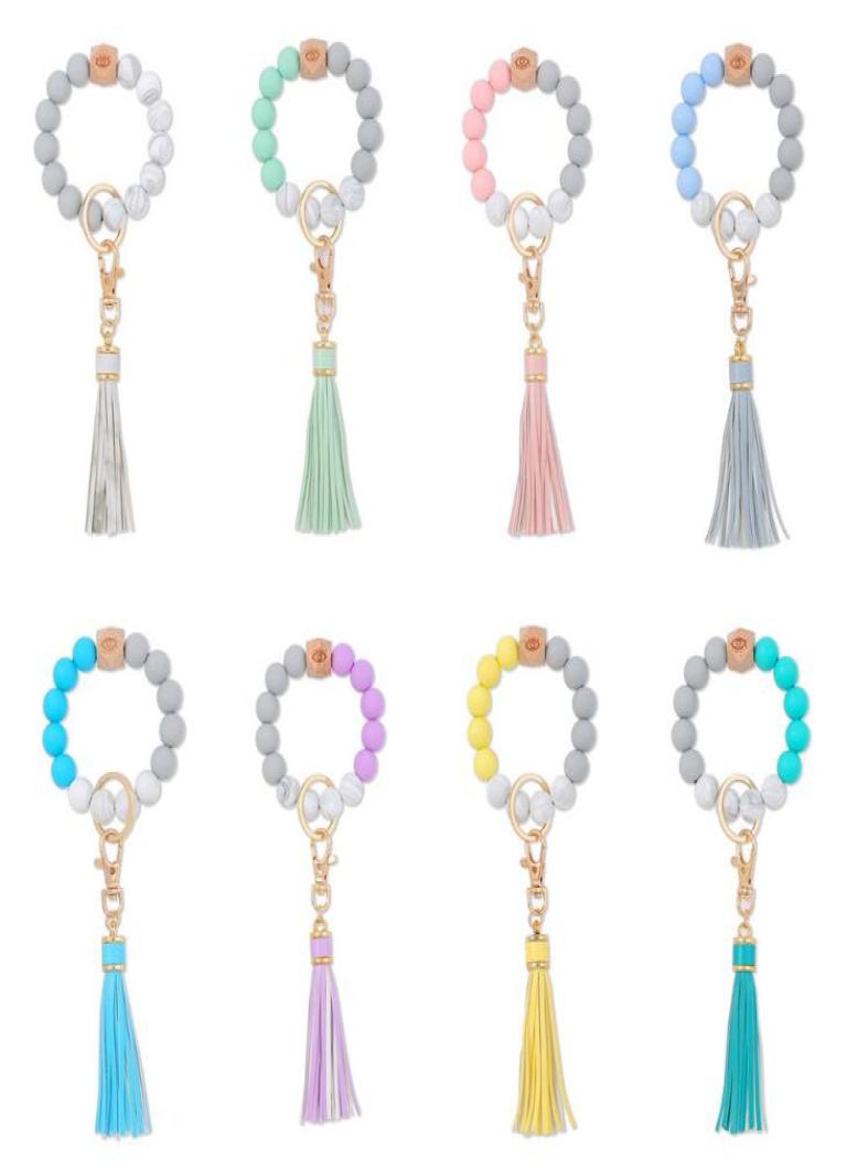 8 Colors Silicone Bead Bracelet Keychain Female Bracelets Key Ring Tassel Wooden Beads Food Grade Girl Keyring Wrist Strap4319315
8 Colors Silicone Bead Bracelet Keychain Female Bracelets Key Ring Tassel Wooden Beads Food Grade Girl Keyring Wrist Strap4319315