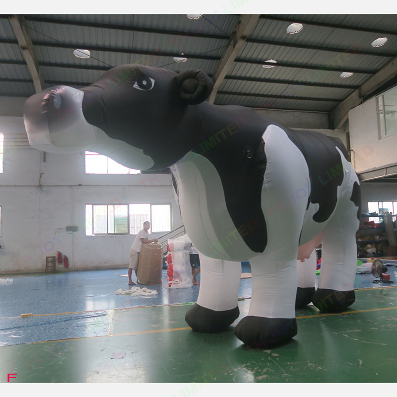 wholesale Outdoor Activities Customizable purple color twist neck cow giant inflatable animal milk cow cattle for farm advertising