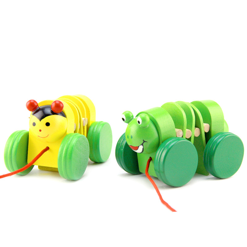 

Wooden cartoon animals pulling carts, children holding ropes, wooden pulling carts, toddlers, early childhood education, and puzzle stalls are selling well