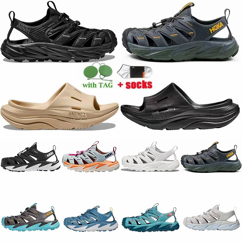 2023 Hoka Hopara Designer Sandals For Men Women Walking Function Triple Black Sand Sandale Luxurys ORA Recovery Slide 3 Dad Slides Sliders claquette
2023 Hoka Hopara Designer Sandals For Men Women Walking Function Triple Black Sand Sandale Luxurys ORA Recovery Slide 3 Dad Slides Sliders claquette