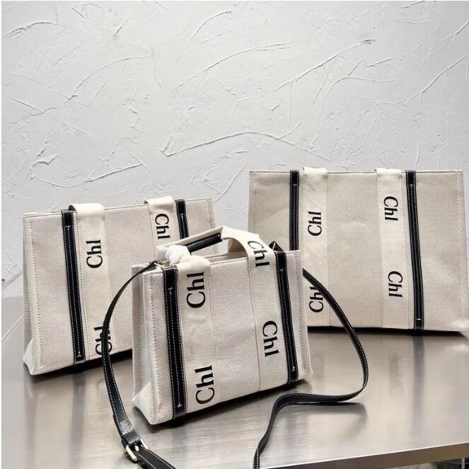 The Tote Bag Luxury Designer Woody Totes Shopping Bags 10A High Quality Canvas Handbag Crossbody Bags Shoulder Bags Travel Beach Bag Wallet Purses Dhgate Bags, Black ribbon
The Tote Bag Luxury Designer Woody Totes Shopping Bags 10A High Quality Canvas Handbag Crossbody Bags Shoulder Bags Travel Beach Bag Wallet Purses Dhgate Bags, Black ribbon