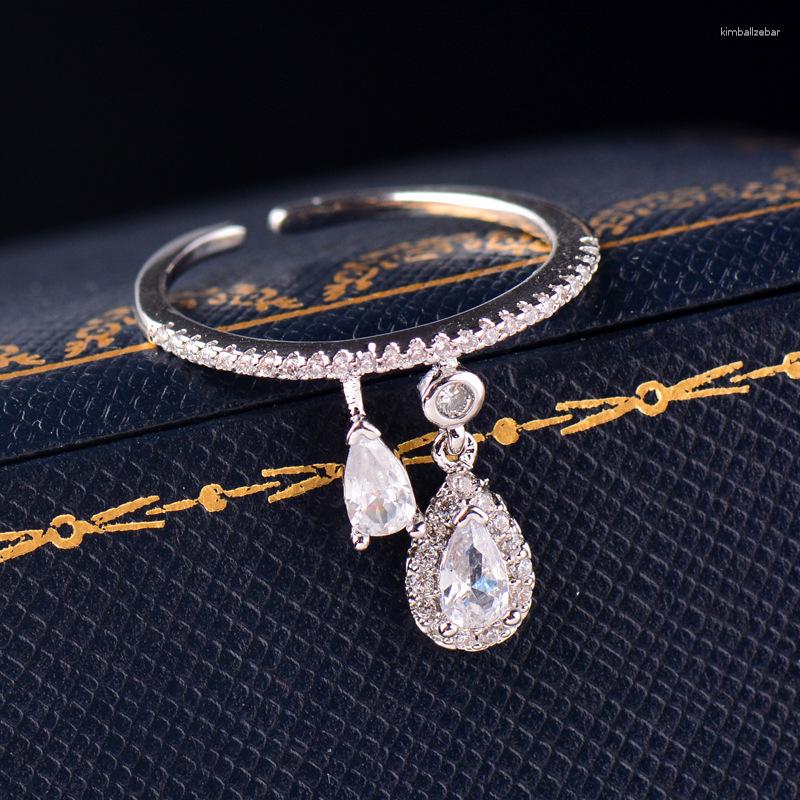 Wedding Rings Huitan Waterdrop Pendant Resizable For Women Paved Sparking CZ Fashion Engagement Bands Lady Jewelry Drop
Wedding Rings Huitan Waterdrop Pendant Resizable For Women Paved Sparking CZ Fashion Engagement Bands Lady Jewelry Drop