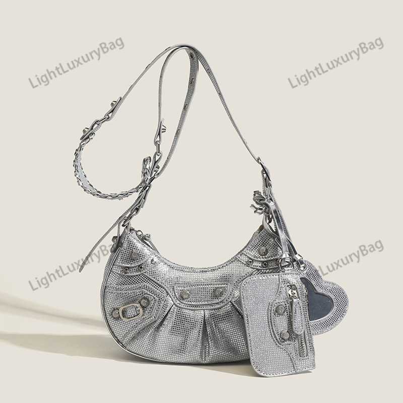 Designer Le Cagole Mini Metallic Leather Shoulder Bag Rivet Locomotive Bag Sweet Cool Spicy Girl Pleated Crescent Bag Underarm Bag, Pink11
Designer Le Cagole Mini Metallic Leather Shoulder Bag Rivet Locomotive Bag Sweet Cool Spicy Girl Pleated Crescent Bag Underarm Bag, Pink11