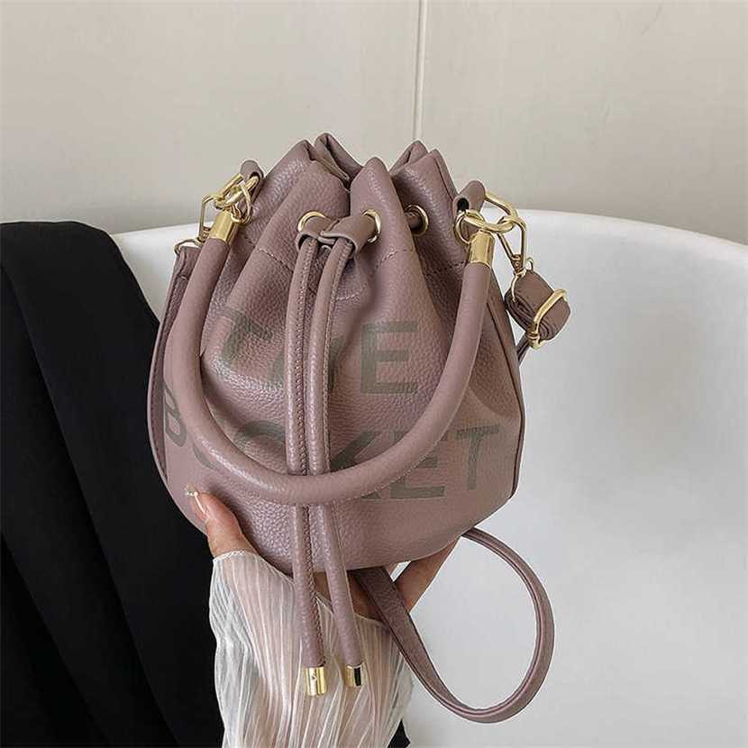 Designer bag 2023 handbag New Letter Drawstring Bucket Multi Color PU Simple One Shoulder Crossbody Women's, Black11
Designer bag 2023 handbag New Letter Drawstring Bucket Multi Color PU Simple One Shoulder Crossbody Women's, Black11