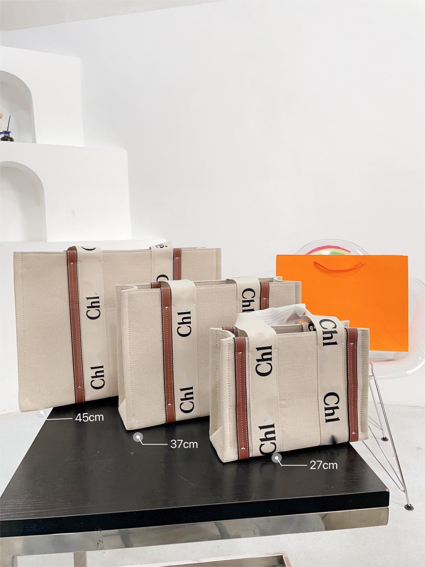 Top quality fashion designer tote bag Women Handbags Woody Tote Shopping Bag Handbag Quality Canvas Nylon Fashion Linen Large Beach Bags Designer Travel Crossbody
Top quality fashion designer tote bag Women Handbags Woody Tote Shopping Bag Handbag Quality Canvas Nylon Fashion Linen Large Beach Bags Designer Travel Crossbody