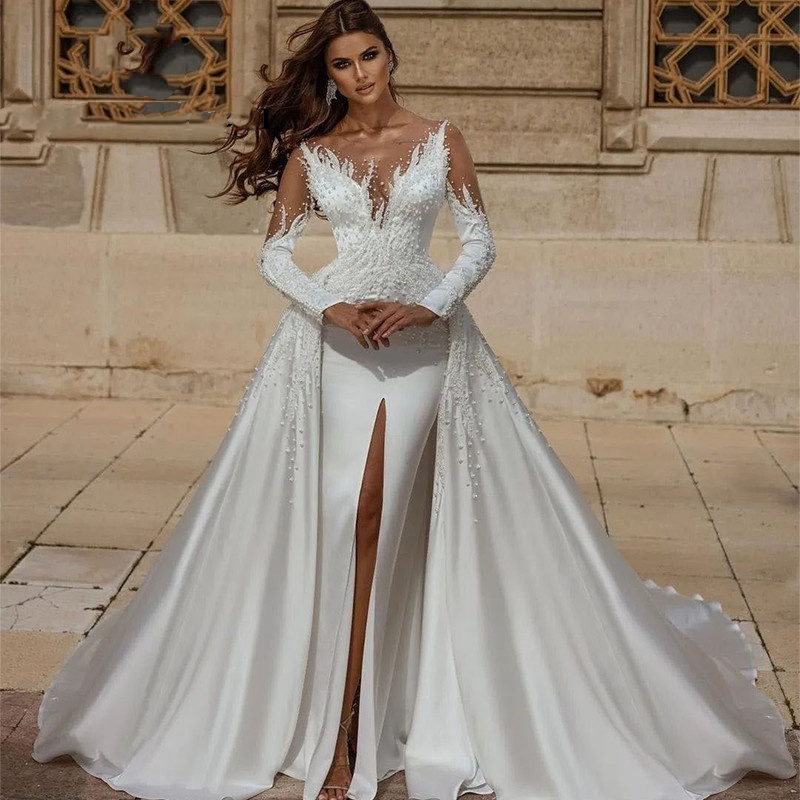 Luxury Mermaid Wedding Dresses Front Slit Pearls Beaded Satin Long Sleeves Bridal Gowns With Detachable Train Sheer Neck Modern Arabic Dubai Vestido D