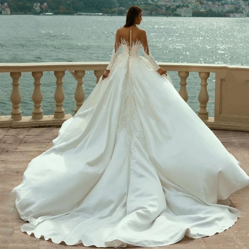 Luxury Mermaid Wedding Dresses Front Slit Pearls Beaded Satin Long Sleeves Bridal Gowns With Detachable Train Sheer Neck Modern Arabic Dubai Vestido D
