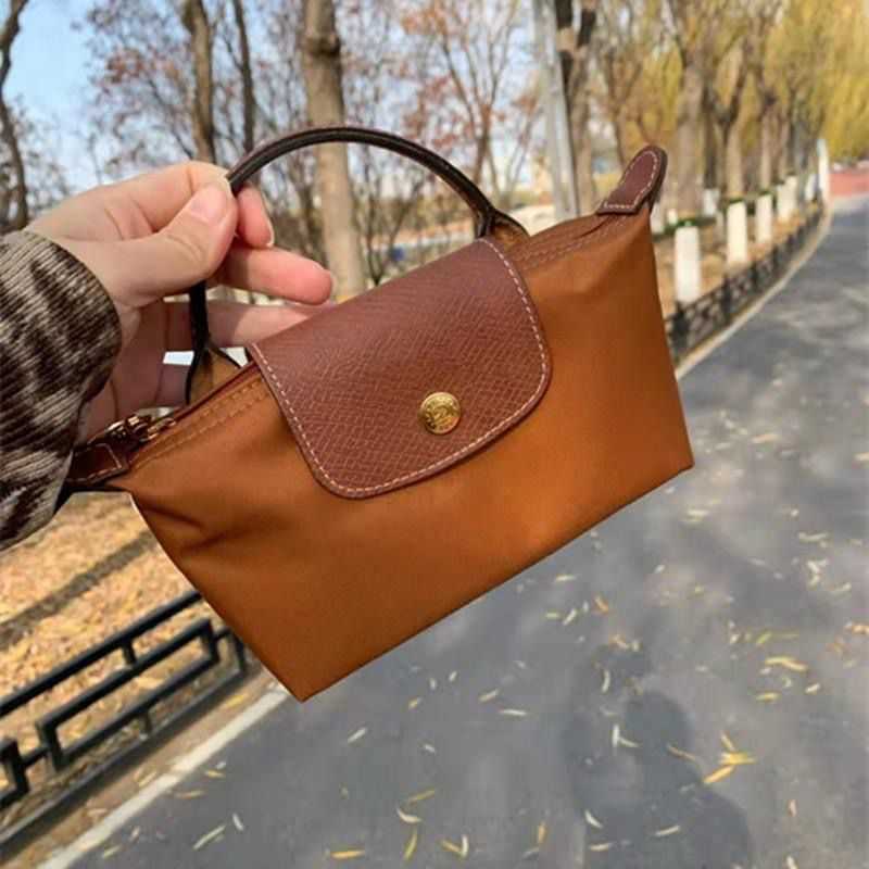 New Handbag designer cross-body bag tote bag nylon dumplings handbags Clearance wholesale Mini waterproof handheld wallet, Light pink
New Handbag designer cross-body bag tote bag nylon dumplings handbags Clearance wholesale Mini waterproof handheld wallet, Light pink