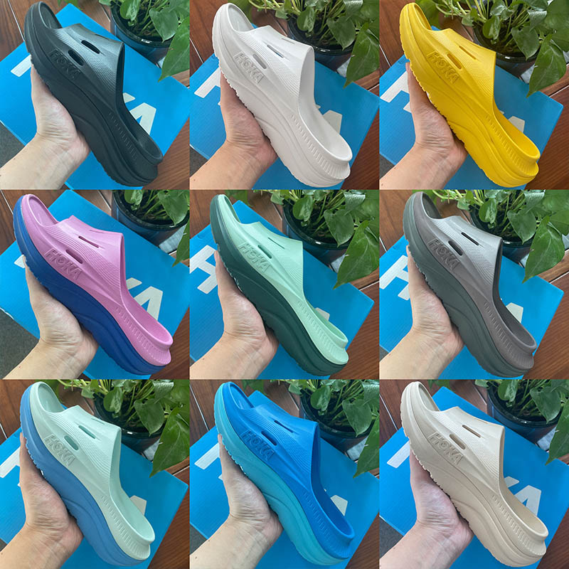 Hokas Slide 3 Designer Mens Womens Slippers Free People Shifting Sand Lifestyle Triple Black White Slipper for Mens Slides Dhgates Sliders Size EUR 36-45
Hokas Slide 3 Designer Mens Womens Slippers Free People Shifting Sand Lifestyle Triple Black White Slipper for Mens Slides Dhgates Sliders Size EUR 36-45