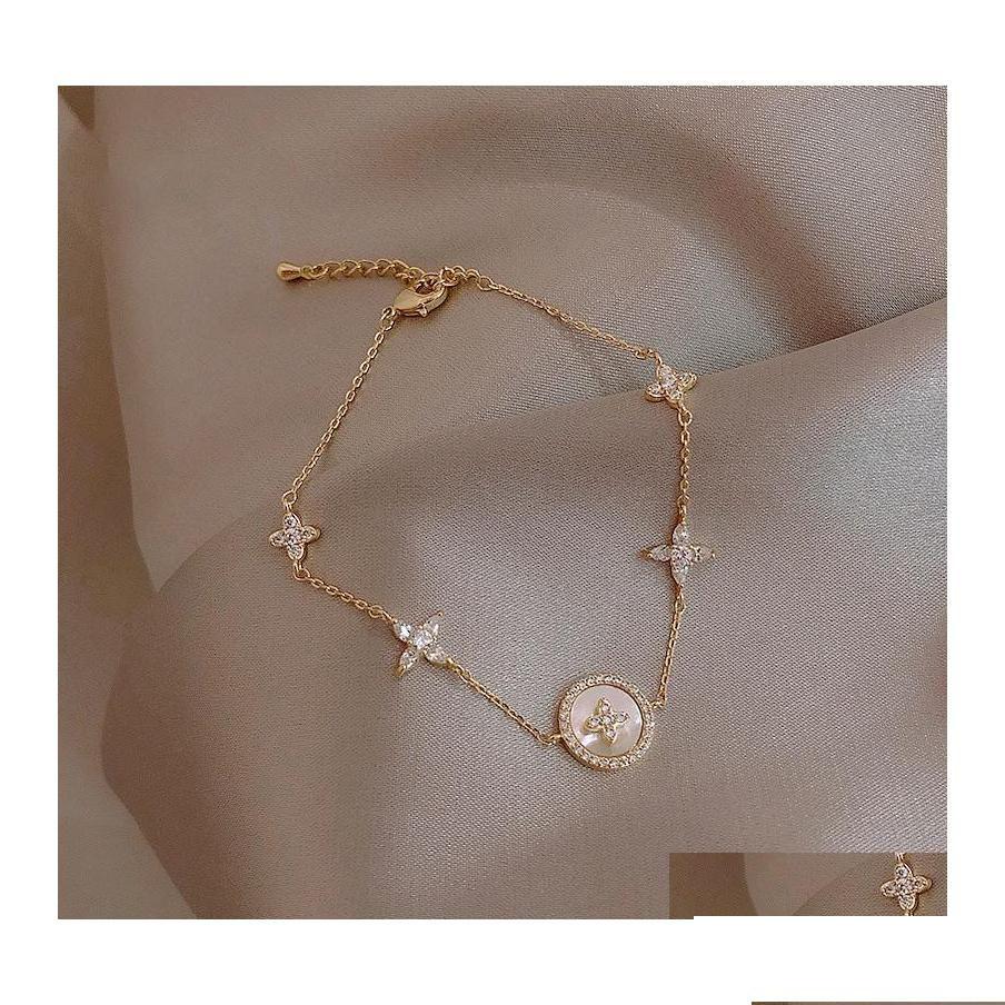 Chain Link Bracelet Womens Micro Set Zircon Plum Blossom Cross Light Luxury Highgrade Feeling Ring Net Red Korean Niche Drop Delive Dhbpj
Chain Link Bracelet Womens Micro Set Zircon Plum Blossom Cross Light Luxury Highgrade Feeling Ring Net Red Korean Niche Drop Delive Dhbpj