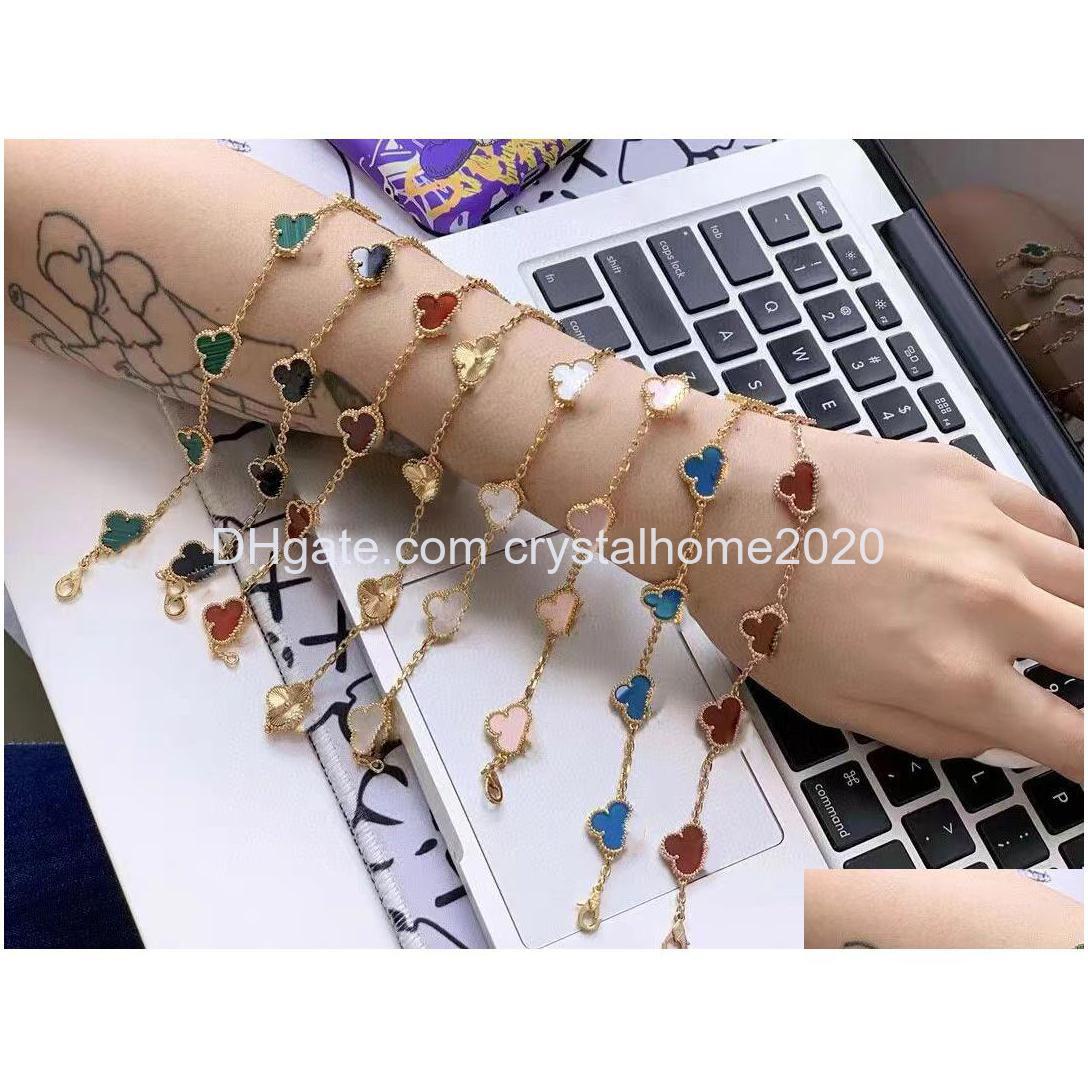 Charm Bracelets Luxury Clover Four Designer Fashion For Girls Women 18K Gold Sier Black White Red Green Brand Bracelet Wedding Party Dhynx
Charm Bracelets Luxury Clover Four Designer Fashion For Girls Women 18K Gold Sier Black White Red Green Brand Bracelet Wedding Party Dhynx