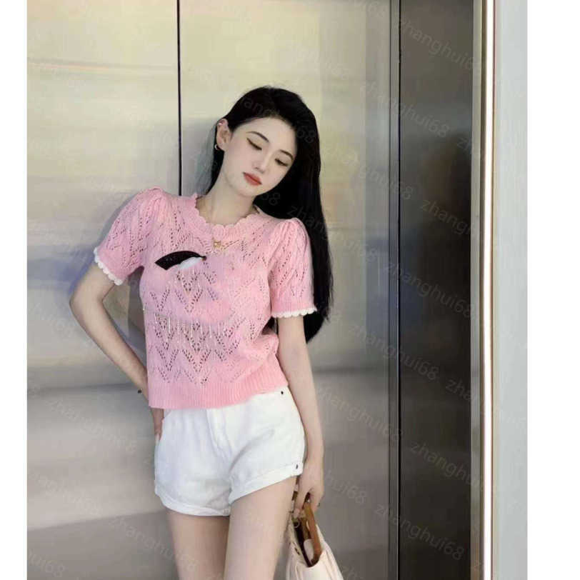 23ss Womens Knits womens designer clothing Double C color pearl chain embroidery hollow knitting short-sleeved tops High quality womens clothes a1
23ss Womens Knits womens designer clothing Double C color pearl chain embroidery hollow knitting short-sleeved tops High quality womens clothes a1