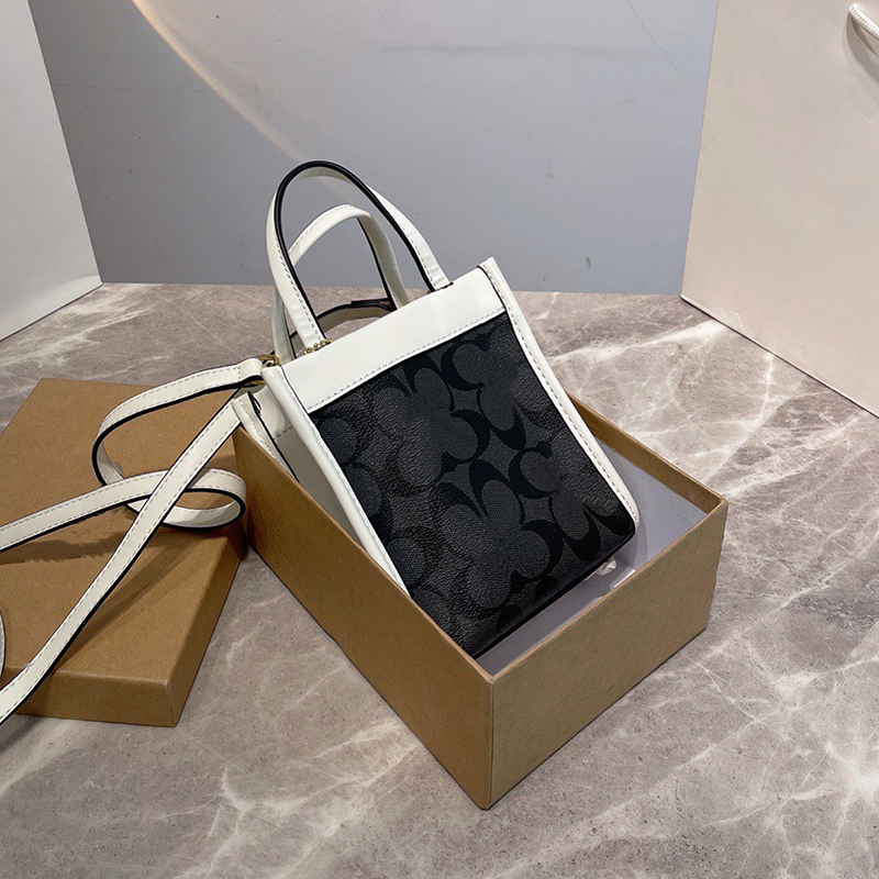 Designer Leather Lady Mommy Field Mini Cally Tote Original Shopping Totes Purse Shoulder Bag Coac Luxury Multicolors High Quality Handbags Totes Bags Size 14x16cm, Dlive 22cm
Designer Leather Lady Mommy Field Mini Cally Tote Original Shopping Totes Purse Shoulder Bag Coac Luxury Multicolors High Quality Handbags Totes Bags Size 14x16cm, Dlive 22cm