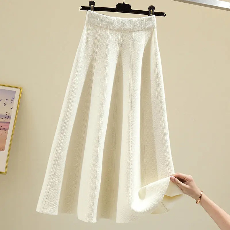 Skirts autumn and winter style western skirt mid-length solid color striped big swing knitted sweater skirt women 231031