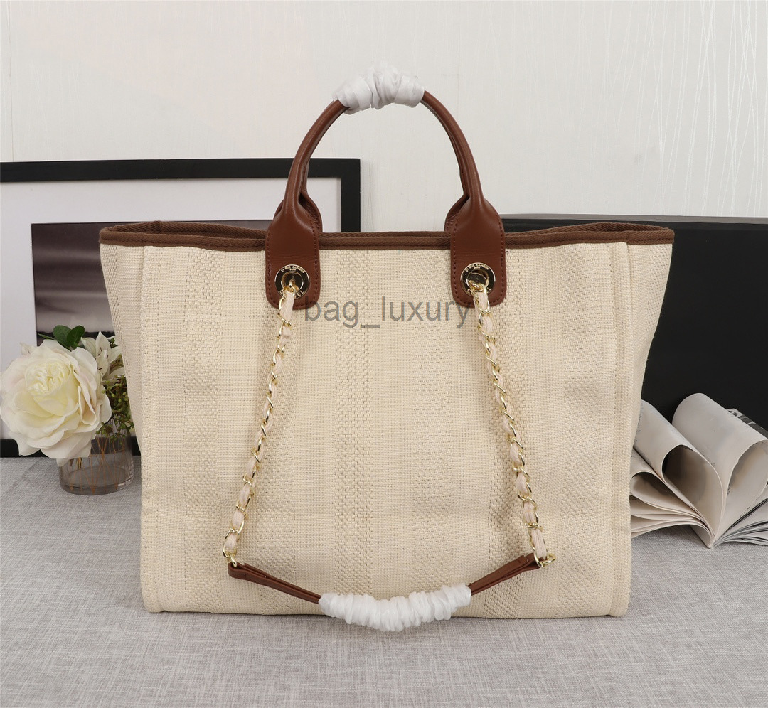 Totes Deauville Denim Classic Bags Chain Tote Sandbeach Wool Felt Designer Canvas Shopping Bag Leather Chains Handbag Brand Luxurys Womens embroidery pattern
Totes Deauville Denim Classic Bags Chain Tote Sandbeach Wool Felt Designer Canvas Shopping Bag Leather Chains Handbag Brand Luxurys Womens embroidery pattern