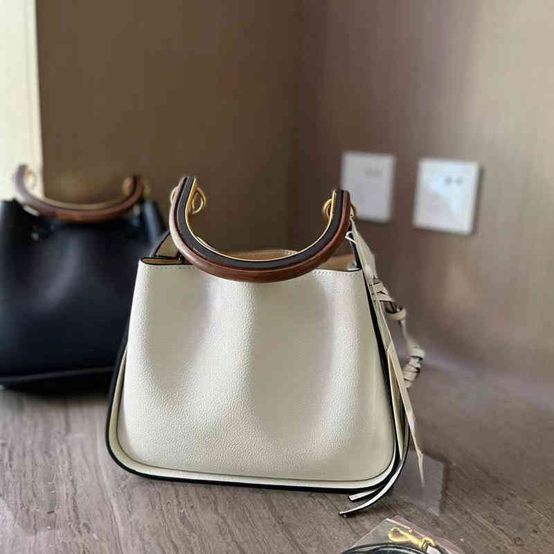 Cross Body bag 2022 brand To new wooden handle bucket blessing organ underarm single shoulder diagonal casual drawstring handbag female, Black
Cross Body bag 2022 brand To new wooden handle bucket blessing organ underarm single shoulder diagonal casual drawstring handbag female, Black