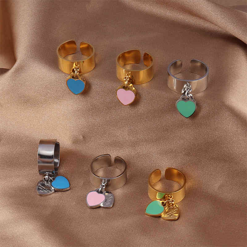Designer Jewelry Ring Fashion Colorful Heart Rings Gold Stainless Steel Big Tag White Open Shell Ring for Women Girls Female Men Wedding Jewelry
Designer Jewelry Ring Fashion Colorful Heart Rings Gold Stainless Steel Big Tag White Open Shell Ring for Women Girls Female Men Wedding Jewelry