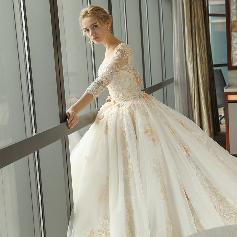 Arabic Gorgeous Ball Gown Wedding Dresses Champagne Lace Appliques Scoop Neck 3/4 Long Sleeves Sweep Train Puffy Tulle Open Back Bridal Gowns