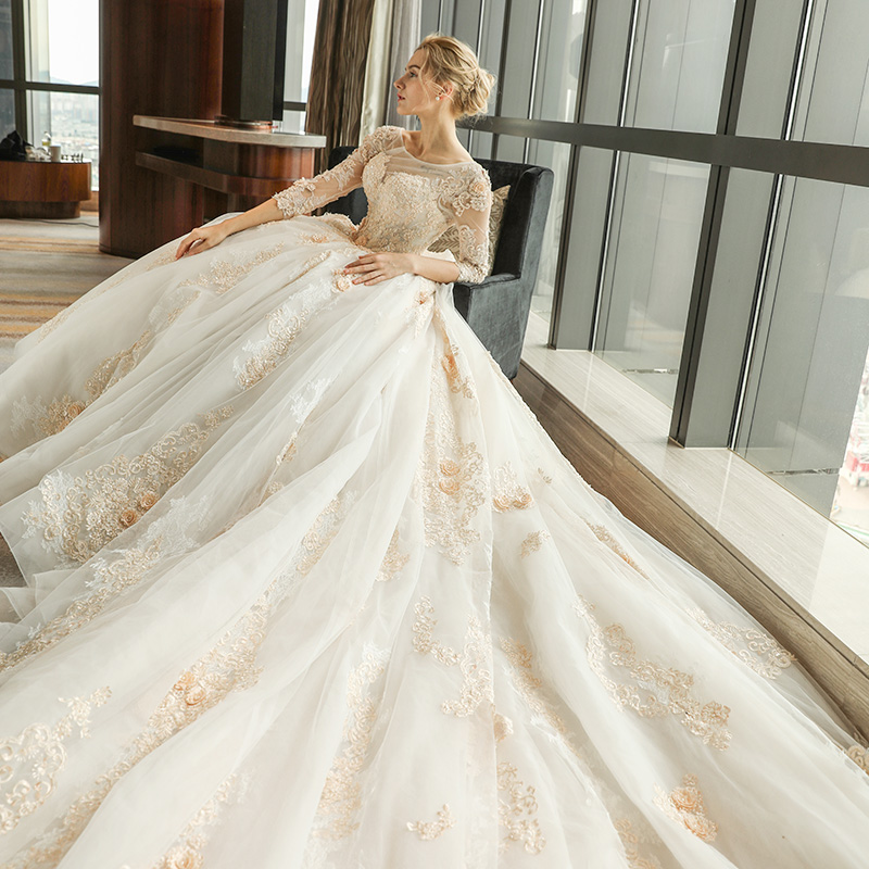 Arabic Gorgeous Ball Gown Wedding Dresses Champagne Lace Appliques Scoop Neck 3/4 Long Sleeves Sweep Train Puffy Tulle Open Back Bridal Gowns