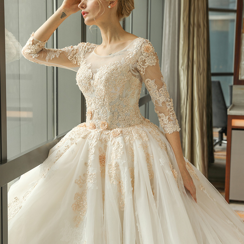 Arabic Gorgeous Ball Gown Wedding Dresses Champagne Lace Appliques Scoop Neck 3/4 Long Sleeves Sweep Train Puffy Tulle Open Back Bridal Gowns