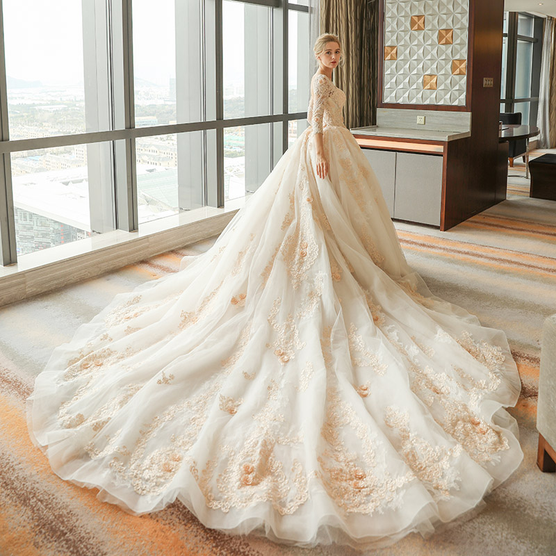 Arabic Gorgeous Ball Gown Wedding Dresses Champagne Lace Appliques Scoop Neck 3/4 Long Sleeves Sweep Train Puffy Tulle Open Back Bridal Gowns