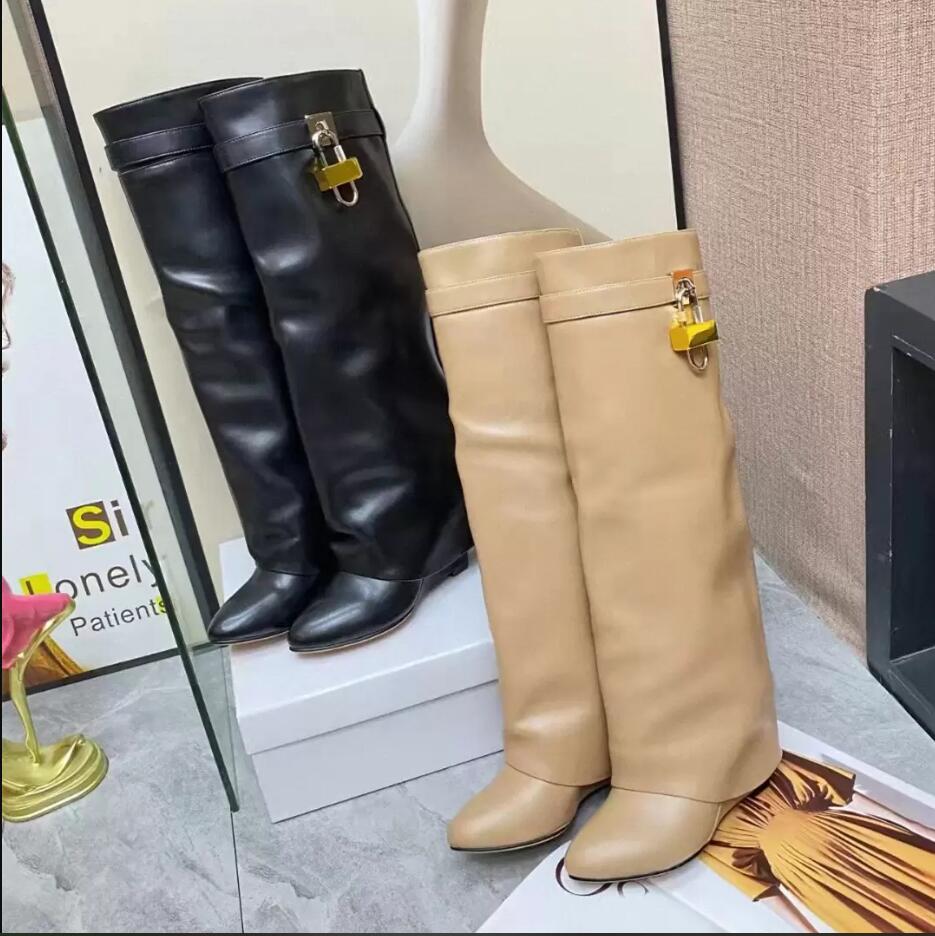 Knee Boots Leather Silver Gold Finish Asymmetrical Metal Padlock Clad Wedge Almond Shaped Toe Heel 2022 Shark Lock Pant, Black
Knee Boots Leather Silver Gold Finish Asymmetrical Metal Padlock Clad Wedge Almond Shaped Toe Heel 2022 Shark Lock Pant, Black