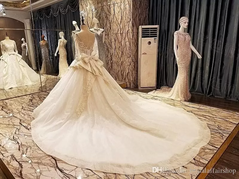 Light Champagne Wedding Dresses Bridal Gown Peplum Bow Lace Applique Beadedlong Sleeves Plus Size Sweep Train Custom Made Vestido De Novia