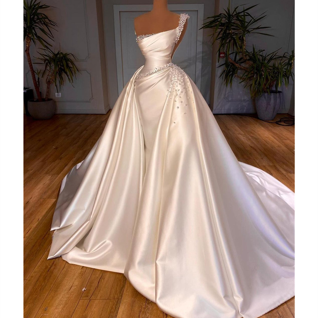 White Mermaid Wedding Dresses Sleeveless Bateau One Shoulder Sequins Pearls Appliques Detachable Train Satin Satin Bridal Gowns Sweep Train Vestido de