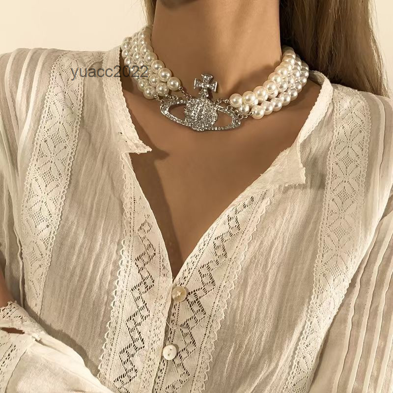 Pendant Necklaces West Vivian Westwood Vivian multilayer double-layer pearl diamond Saturn Necklace light luxury net red same clavicle chain fashion
Pendant Necklaces West Vivian Westwood Vivian multilayer double-layer pearl diamond Saturn Necklace light luxury net red same clavicle chain fashion