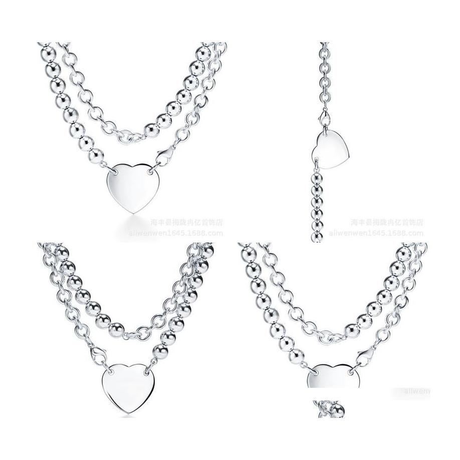 Pendant Necklaces Pendant Necklaces Ball Lock Double Chain Design Brand Heart Love Necklace Siery For Women Jewelry Gift Drop Delive Dhdq2
Pendant Necklaces Pendant Necklaces Ball Lock Double Chain Design Brand Heart Love Necklace Siery For Women Jewelry Gift Drop Delive Dhdq2