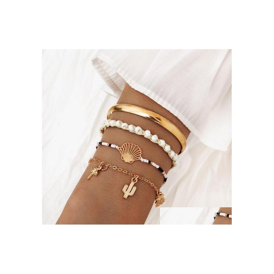 Charm Bracelets Fashion Jewelry 4Pcs/Set Bracelet Handwoven Beads Cactus Pineapple Coconut Palm Pendant Chain Bangle Bracelets Set D Dh2Gv
Charm Bracelets Fashion Jewelry 4Pcs/Set Bracelet Handwoven Beads Cactus Pineapple Coconut Palm Pendant Chain Bangle Bracelets Set D Dh2Gv