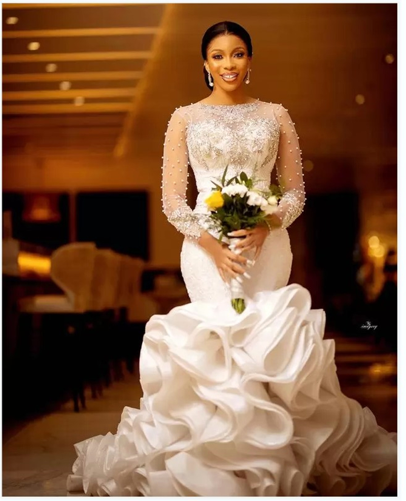 Modern Pearls Beaded Mermaid Wedding Dresses with Lace Appliques Court Train Long Sleeves Tiered Rufffles Bridal Gown Jewel Neckline Arabic African Luxury Dress, White
Modern Pearls Beaded Mermaid Wedding Dresses with Lace Appliques Court Train Long Sleeves Tiered Rufffles Bridal Gown Jewel Neckline Arabic African Luxury Dress, White