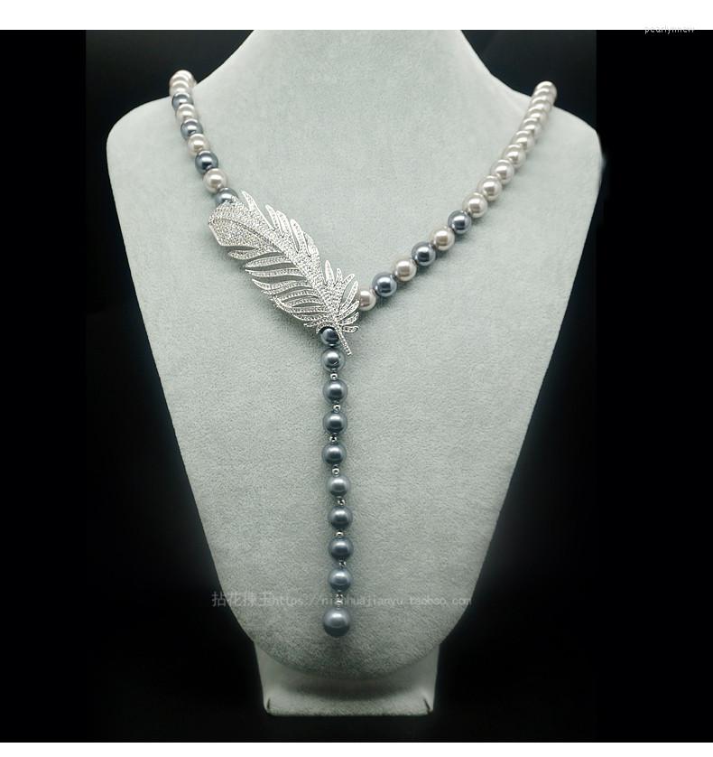 Chains Luxury Feather Zircon Micro 10mm Shell Pearl Necklace 32inch
Chains Luxury Feather Zircon Micro 10mm Shell Pearl Necklace 32inch