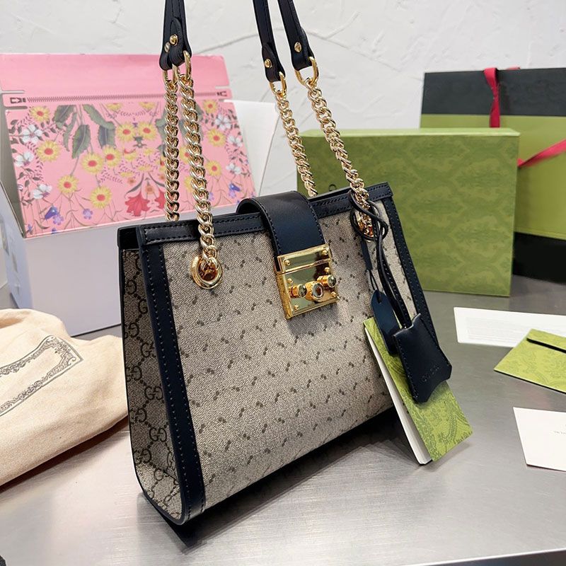 Women Tote Bag Chains Shoulder Bags Beach Handbag Canvas Purse Patchwork Leather Spring Type Square Lock Decoration Gold Letter Hasp Hardware Plain Large Capacity, Customize
Women Tote Bag Chains Shoulder Bags Beach Handbag Canvas Purse Patchwork Leather Spring Type Square Lock Decoration Gold Letter Hasp Hardware Plain Large Capacity, Customize