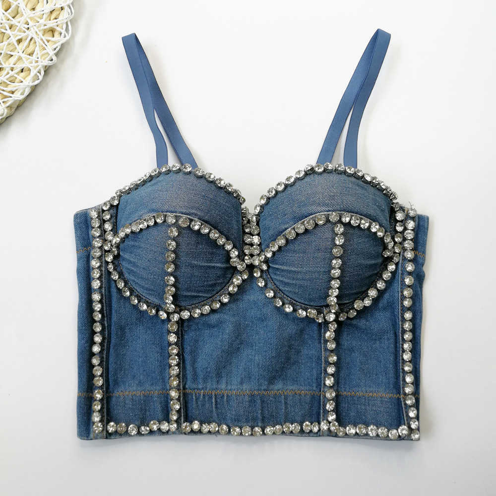 Beaded vest with ball host inside close fitting blouse and jeans sling outside, Denim blue