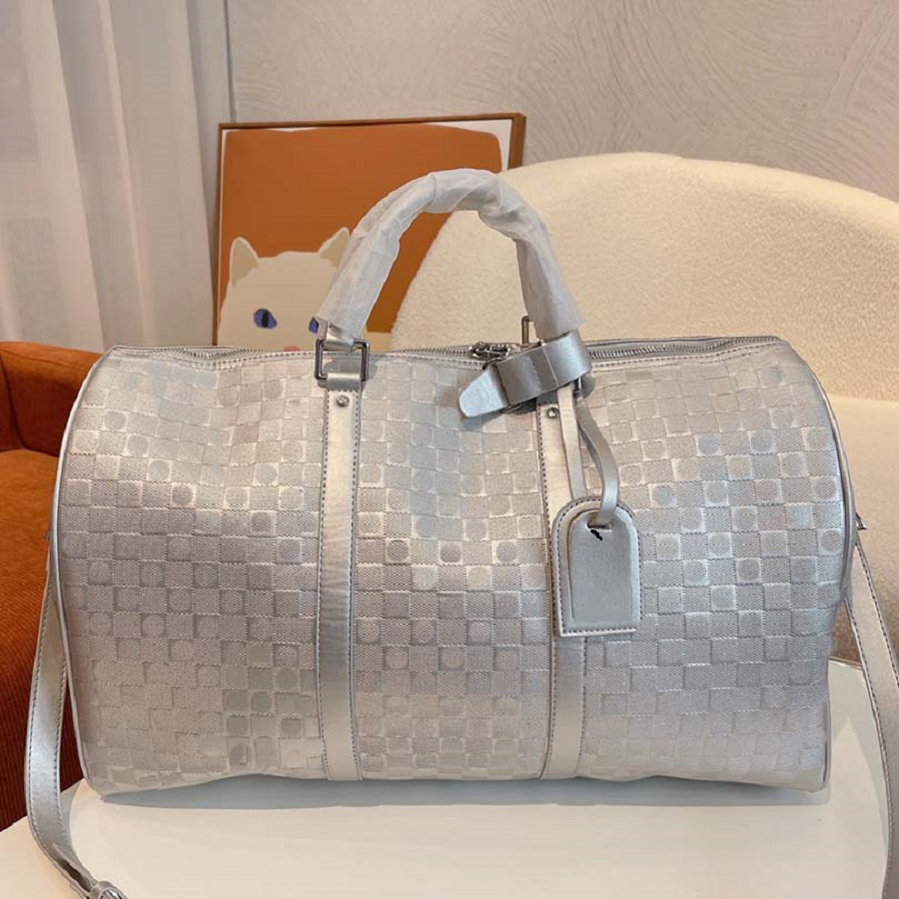 Duffel Bags large capacity travel sale women men Designer Genuine Leather shoulder Fashion bag carry on luggage bottom rivets with lock head top top99 001, #1
Duffel Bags large capacity travel sale women men Designer Genuine Leather shoulder Fashion bag carry on luggage bottom rivets with lock head top top99 001, #1