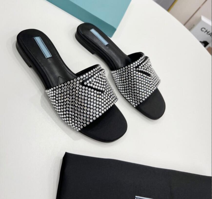Spring 2022 New Crystal diamond Slippers Iconic triangular logo square head women Genuine leather flat shoes with box, Black
Spring 2022 New Crystal diamond Slippers Iconic triangular logo square head women Genuine leather flat shoes with box, Black