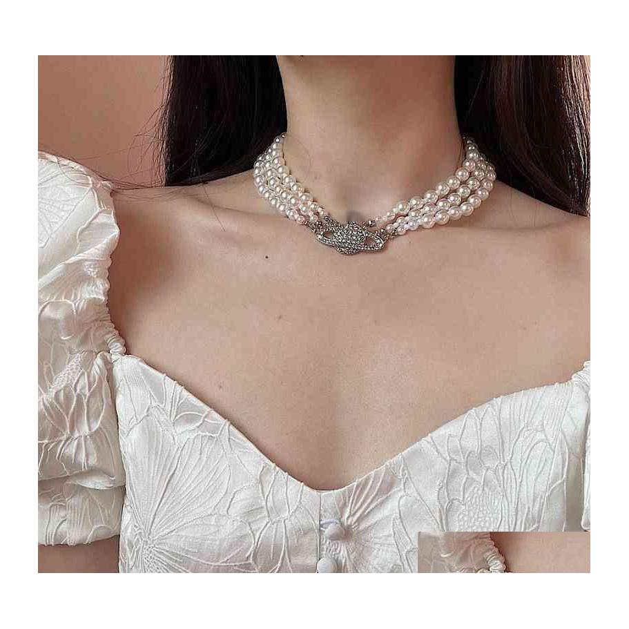 Chokers Vivi Necklace Bracelet Earrings Tide Brand Vw Classic Pearl Chain Diamond Gold Plated Punk Accessories Women High Quality Si Dhula
Chokers Vivi Necklace Bracelet Earrings Tide Brand Vw Classic Pearl Chain Diamond Gold Plated Punk Accessories Women High Quality Si Dhula