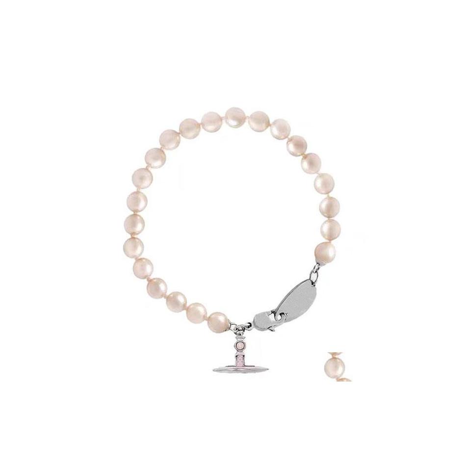 Charm Bracelets Orb Pearl Woman Designer Jewelry Sier Tone Pink Enamel Detailing Along The Ring Pendant Bracelet Birthday Valentines Dhvrg
Charm Bracelets Orb Pearl Woman Designer Jewelry Sier Tone Pink Enamel Detailing Along The Ring Pendant Bracelet Birthday Valentines Dhvrg