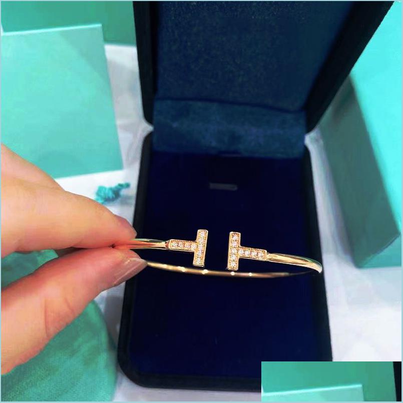 Charm Bracelets Luxury Designers Bracelet Women Diamond T Design Pearls Jewelry Studded With High Quality Boutique Gift Jewelrys Ver Dhu3C
Charm Bracelets Luxury Designers Bracelet Women Diamond T Design Pearls Jewelry Studded With High Quality Boutique Gift Jewelrys Ver Dhu3C