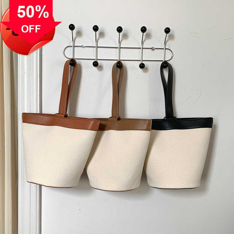 Designer Bags Korean Triumphal Arch Canvas Handheld Bucket Bag Large Capacity 2023 New Women's Simple Versatile Splice Handbag Factory Direct Sale Promotion, Black1
Designer Bags Korean Triumphal Arch Canvas Handheld Bucket Bag Large Capacity 2023 New Women's Simple Versatile Splice Handbag Factory Direct Sale Promotion, Black1