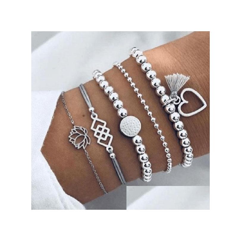 Charm Bracelets Fashion Jewelry Bracelet Set Beaded Heart Hollowed Flower Layered 5Pcs/Set Drop Delivery Dhmx9
Charm Bracelets Fashion Jewelry Bracelet Set Beaded Heart Hollowed Flower Layered 5Pcs/Set Drop Delivery Dhmx9