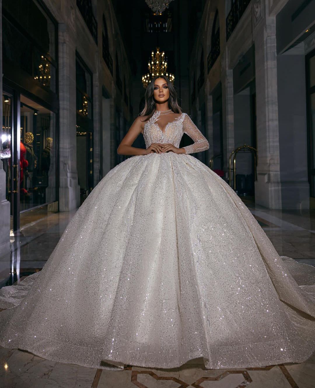 Luxury Ball Gown Wedding Dresses Deep V Neck One Long Sleeve Halter Beads Appliques Sequins 3D Lace Ruffles Celebrity Sparkly Plus Size Bridal Gowns C