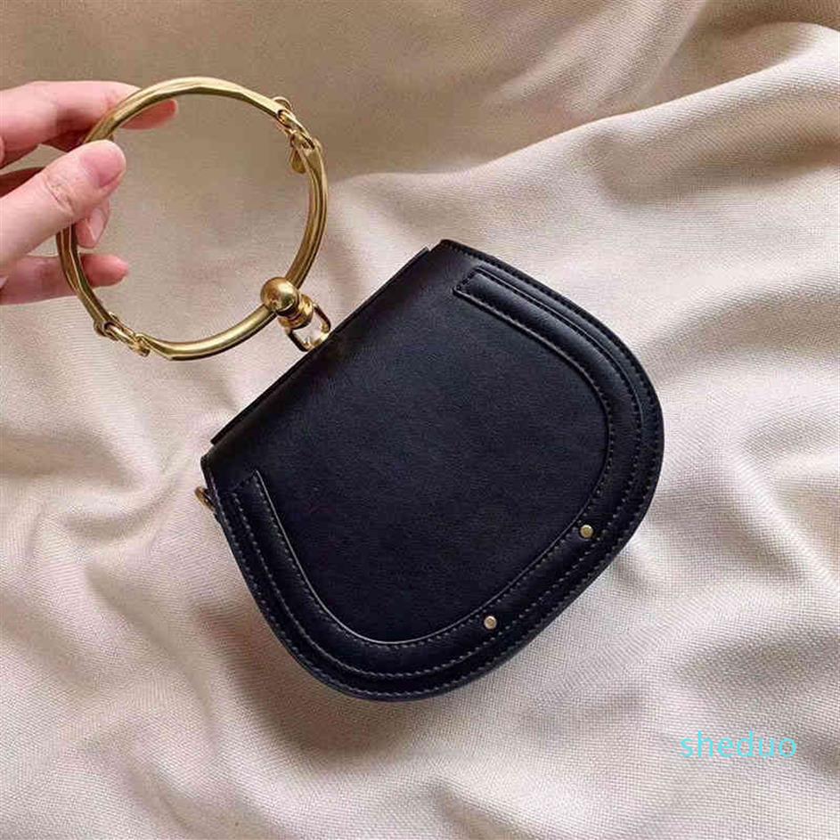 Summer Genuine Leather Metal Ring bags package saddle nile handle Bracelet purse Female Shoulder Messenger Crossbody Tote bag USLE216g, Black
Summer Genuine Leather Metal Ring bags package saddle nile handle Bracelet purse Female Shoulder Messenger Crossbody Tote bag USLE216g, Black