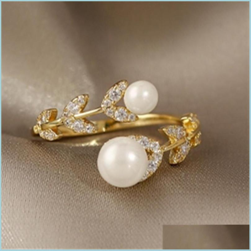 Band Rings Luxury Creative Zircon Leaf Pearl Gold Opening Ring For Woman Korean Fashion Jewelry Gothic Party Girls Unusual Rings Dro Dhsdo
Band Rings Luxury Creative Zircon Leaf Pearl Gold Opening Ring For Woman Korean Fashion Jewelry Gothic Party Girls Unusual Rings Dro Dhsdo